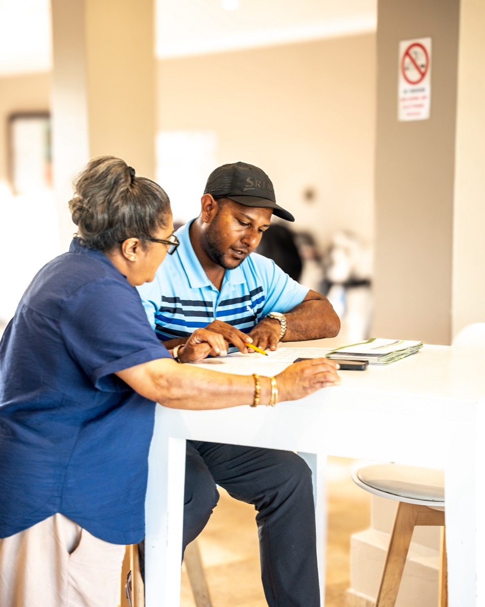 People reviewing operational documents