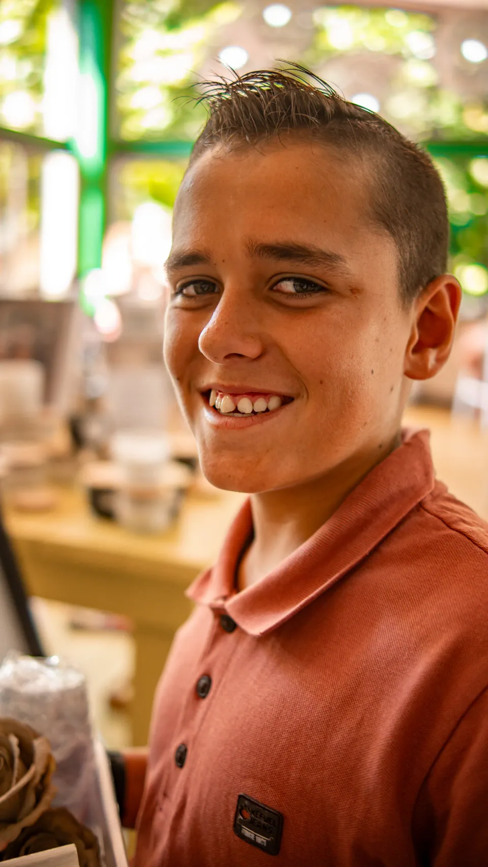 Portrait of a smiling man at a restaurant.